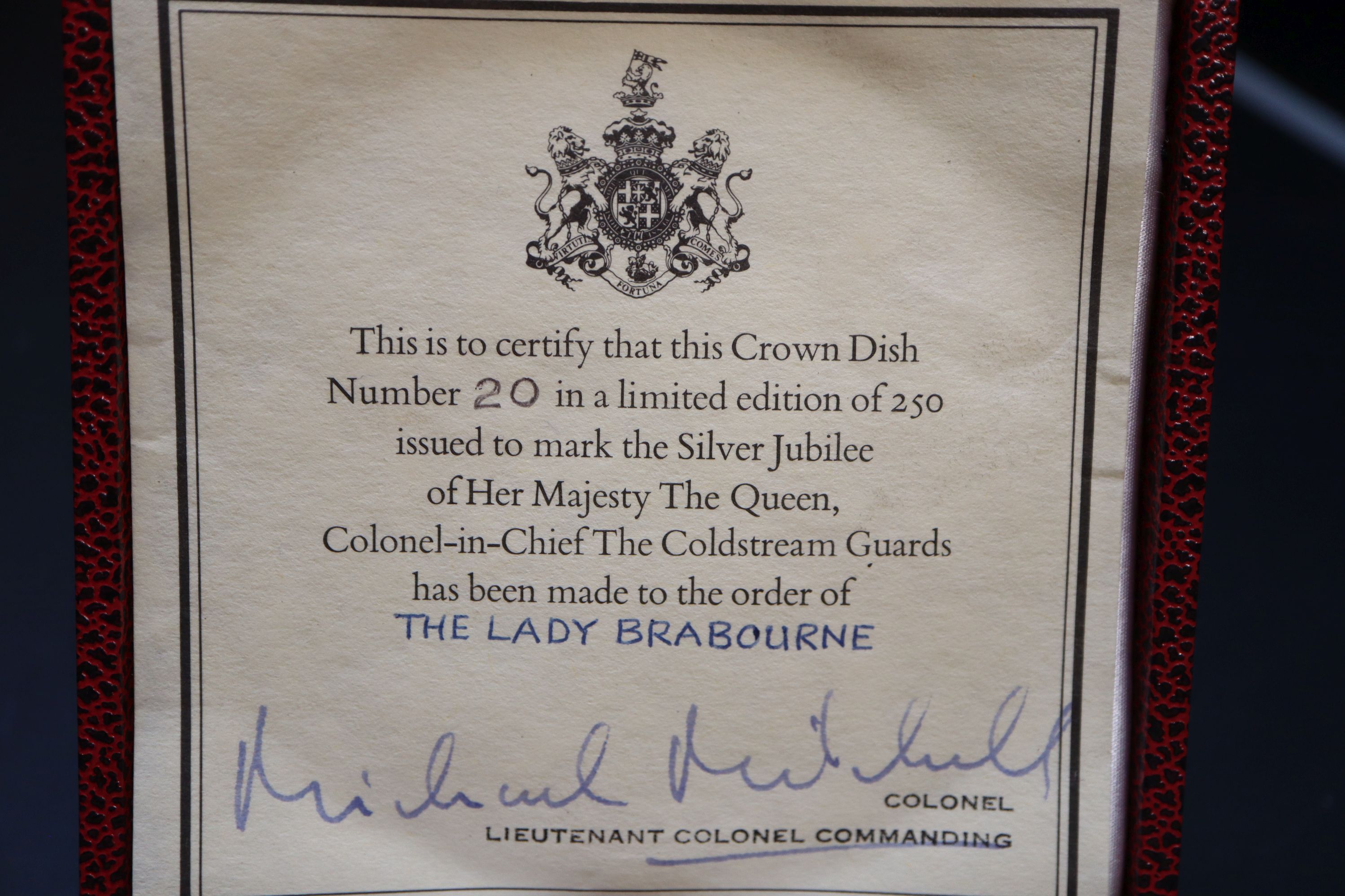 A Queen Elizabeth Silver Jubilee Coldstream Guards commemorative silver armada dish, diameter 10.15cm, cased, gross 79 grams.